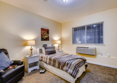 Assisted living and memory care bedroom in Wheat Ridge, CO